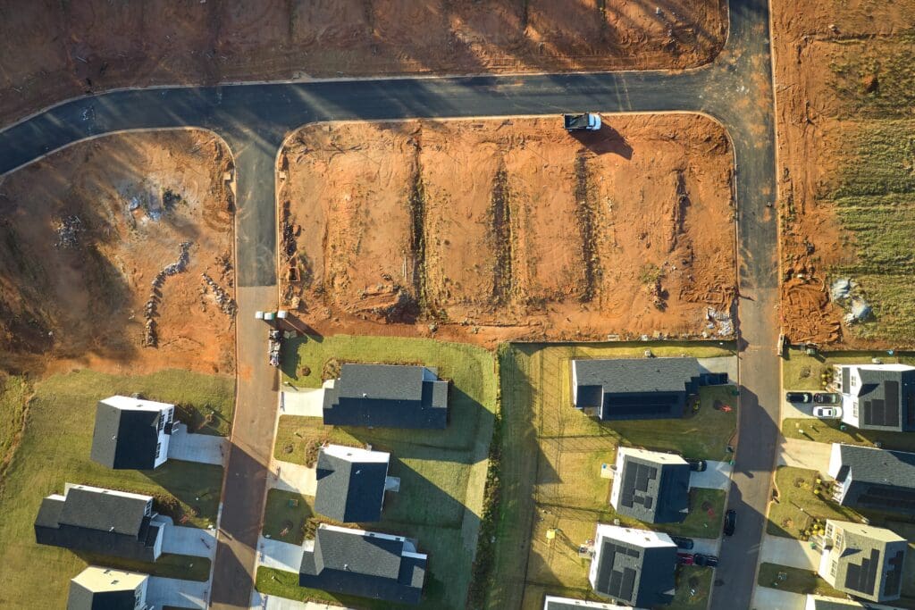 aerial-view-of-construction-site-with-new-tightly-2023-11-27-05-00-55-utc-min